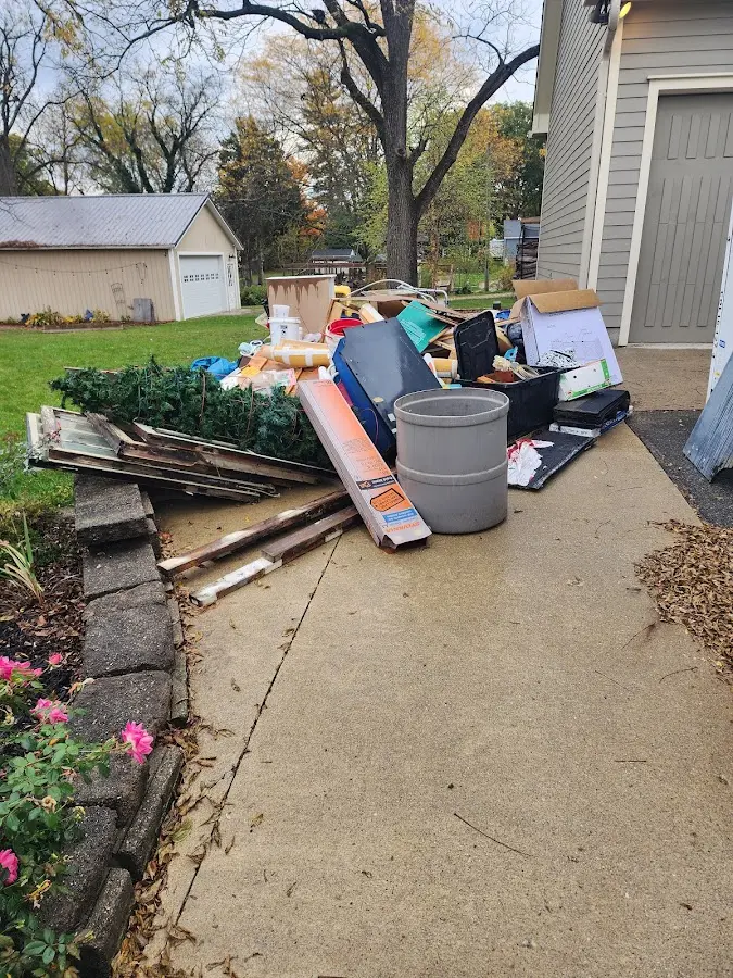 Dumpster being loaded with debris for 12 Yard Dumpster Rental in Moraga